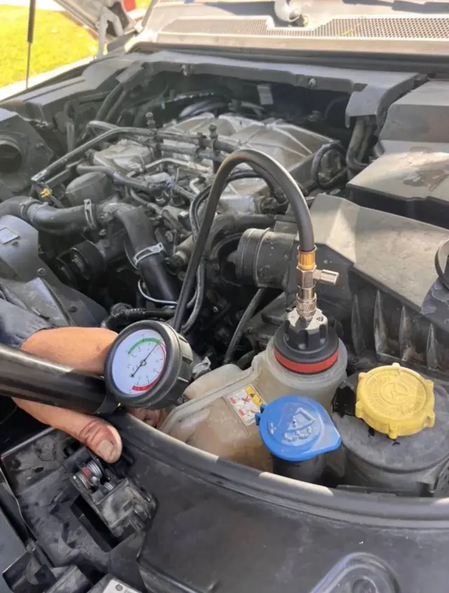 Pressure-testing a cooling system to find a coolant leak